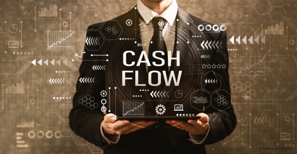 How to Successfully Leverage Cash Flow Through a Crisis business man holding a tablet with cash flow projections