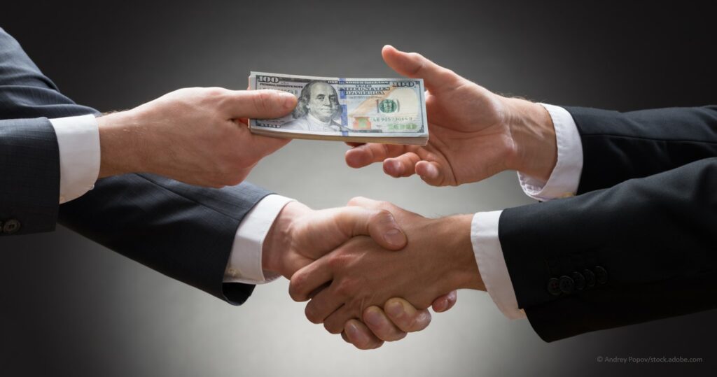 business professionals shaking hands on a loan