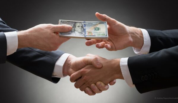 business professionals shaking hands on a loan