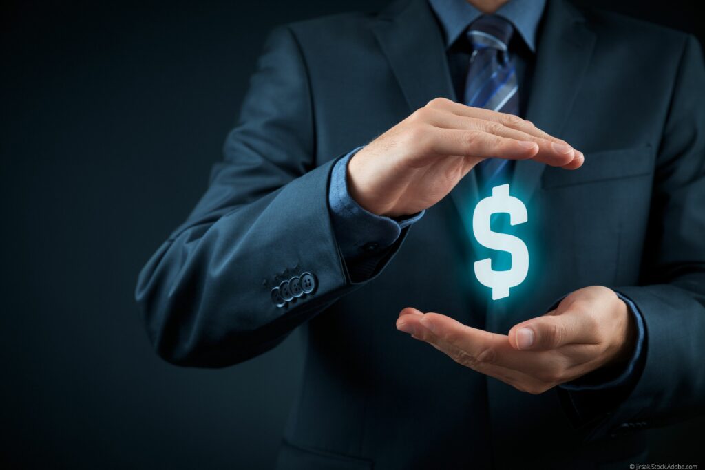 business man holding a money symbol to demonstrate savings