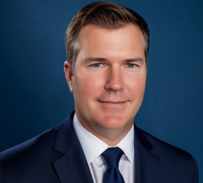 A portrait of Tim Naughton.